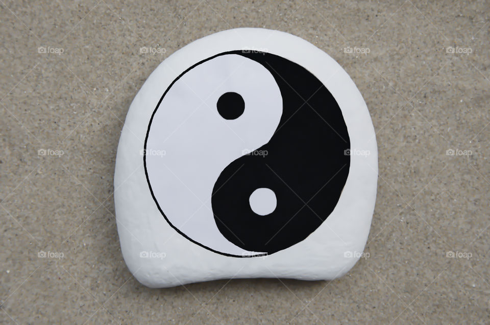 Yin and Yang symbol on a stone