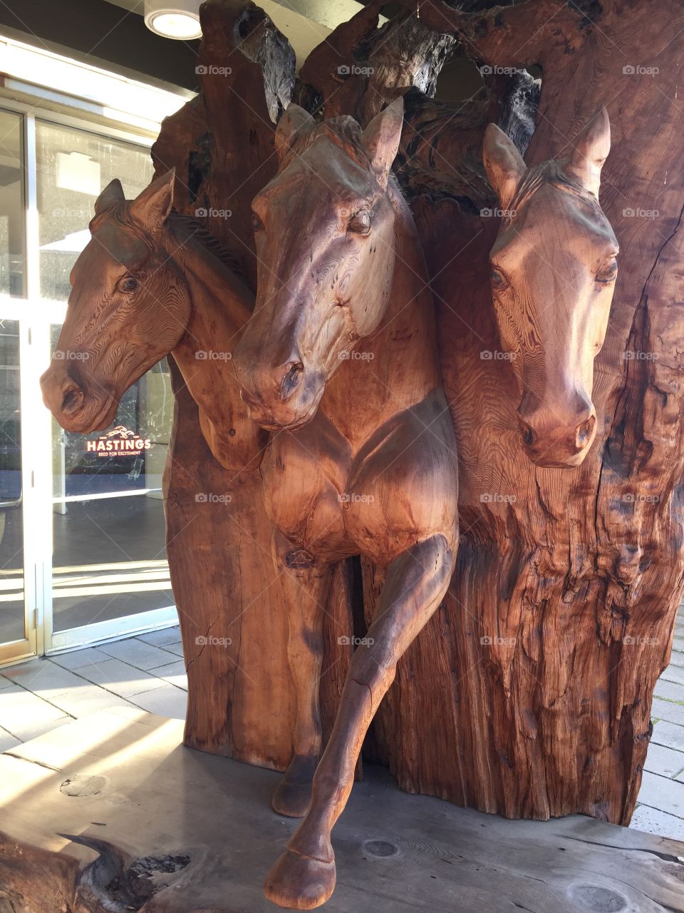 Carved wooden race horses