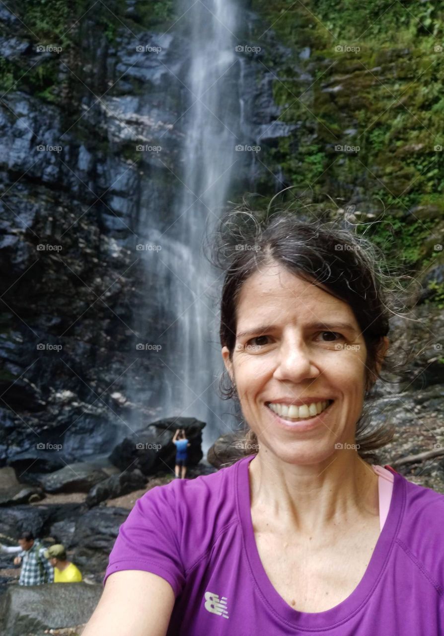 By a waterfall, enjoying nature