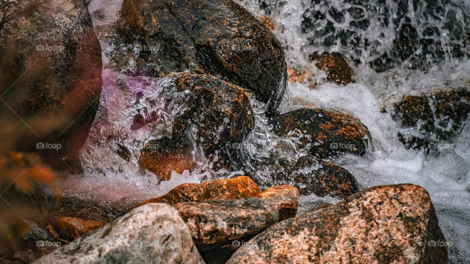 Water fall’s impact on stone.