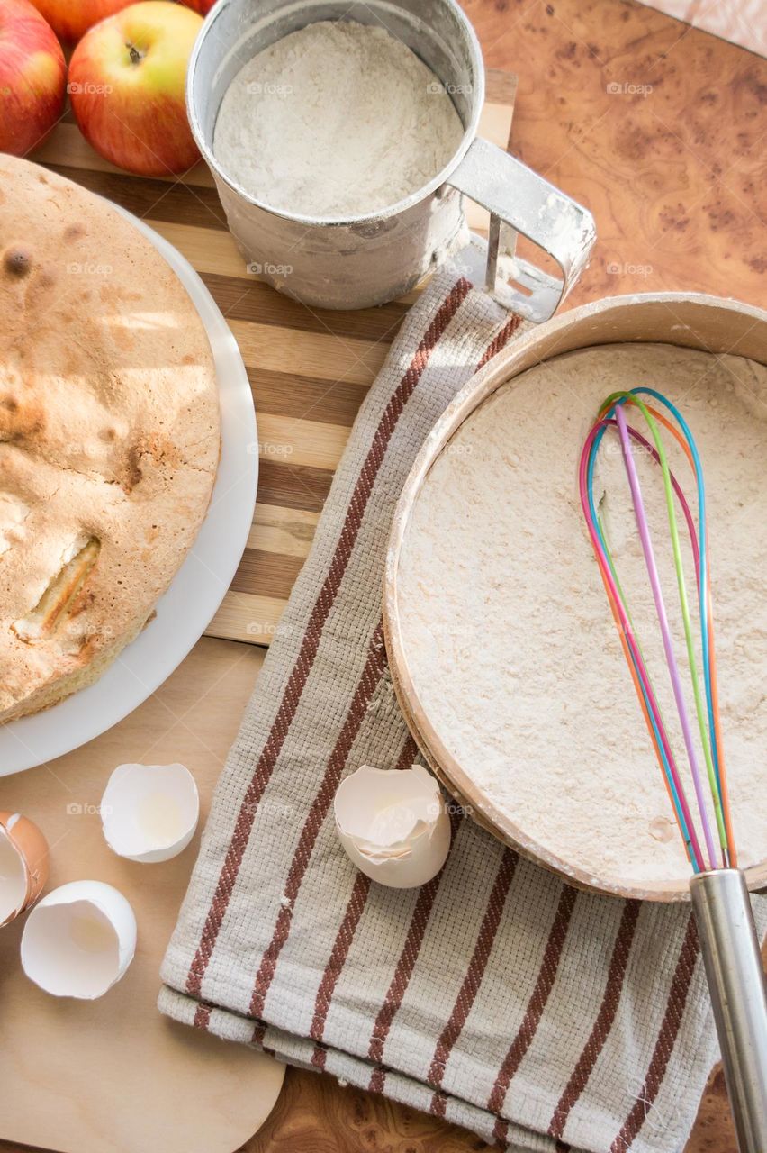 Making homemade puffed apple pie with eggs, sugar and flour.