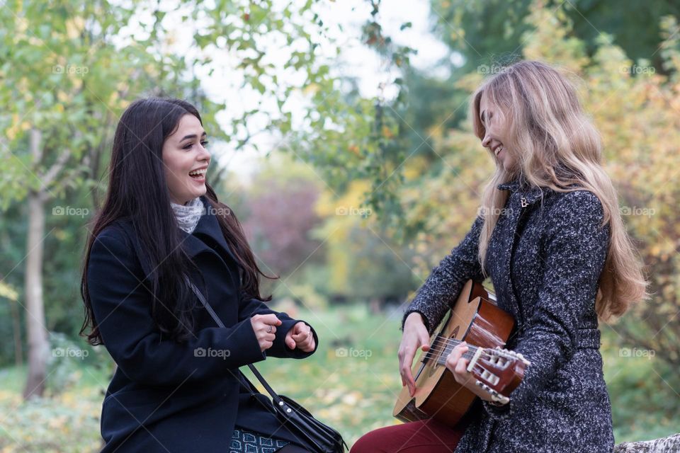 girl playing guitar