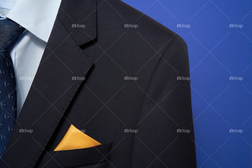 Navy suit with a yellow pocket square 