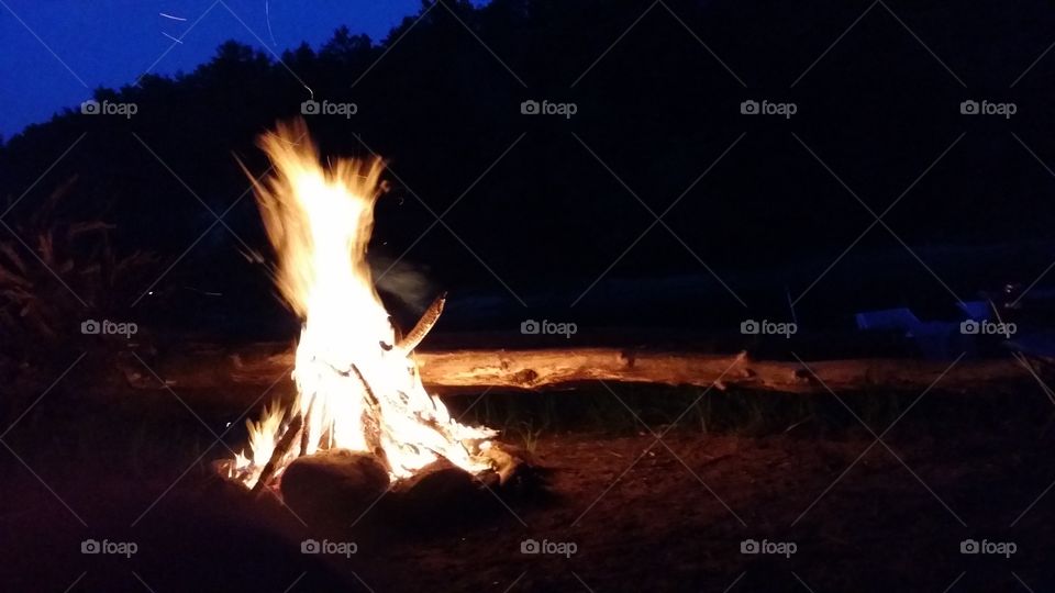 River island camp fire. camping on the river on a summer evening