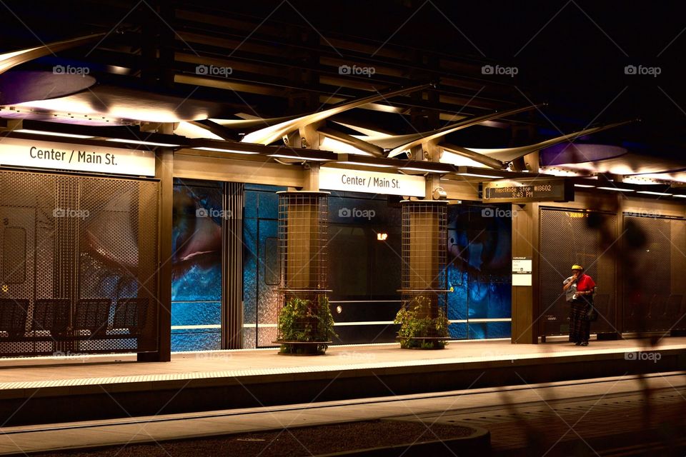 This is a light rail station in Downtown Mesa, AZ. The side of the light rail cars were decorated with a photo of two giant eyes, and when it stopped at it's station, this made for some wicked cool photos. 