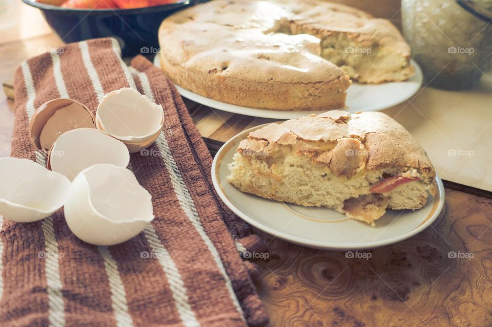 Making homemade puffed apple pie with eggs, sugar and flour.