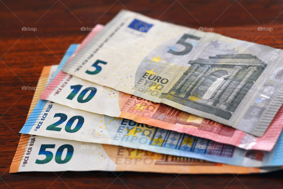 Euro money banknotes on wood table