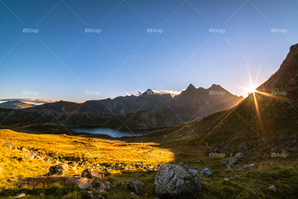 Scenic view sunlight though mountains