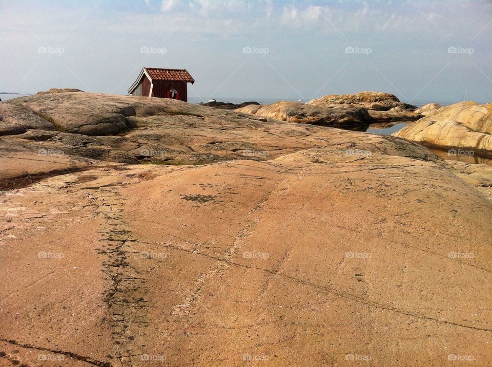 Log cabin and rocks outdoors