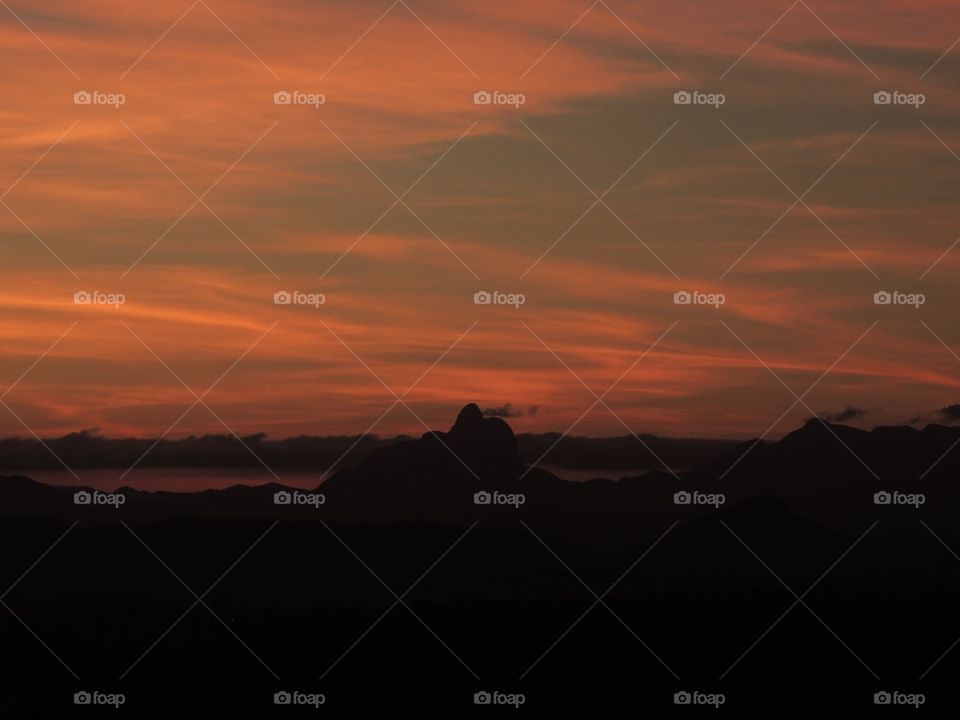 The beauty of Sunset and nature. This photo was taken in Macaé, Rio de Janeiro. It was one of the most beautiful sunsets of the year. I loved the orange color with the contrast of the mountains.