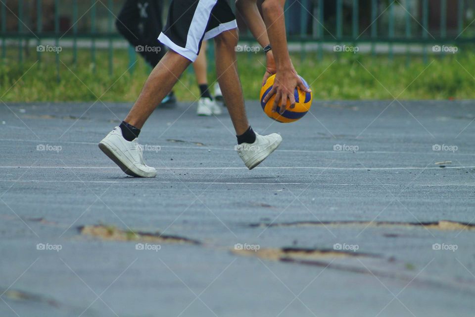 children in the old stadium play football.