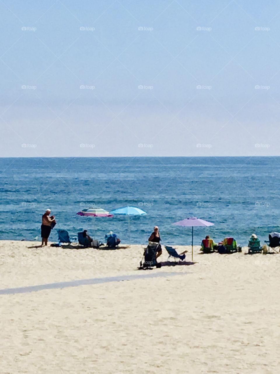 Beach bunnies catching some sun and fun on sunny afternoon at Coopers beach Southampton. 