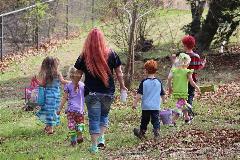 Mother and Kids Easter Egg Hunting