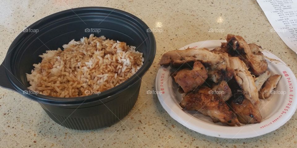 Panda Express teriyaki chicken and a bowl of white rice with sauce