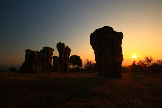sunset at stone pole. Siluet of stone pole in sunset