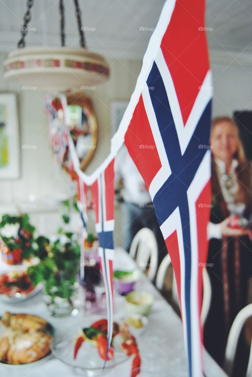 Festive table with good food and decorated for Norways national day