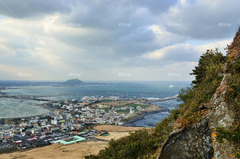 The beautiful view from the volcano Ilchulbong to Jeju island. South Korea