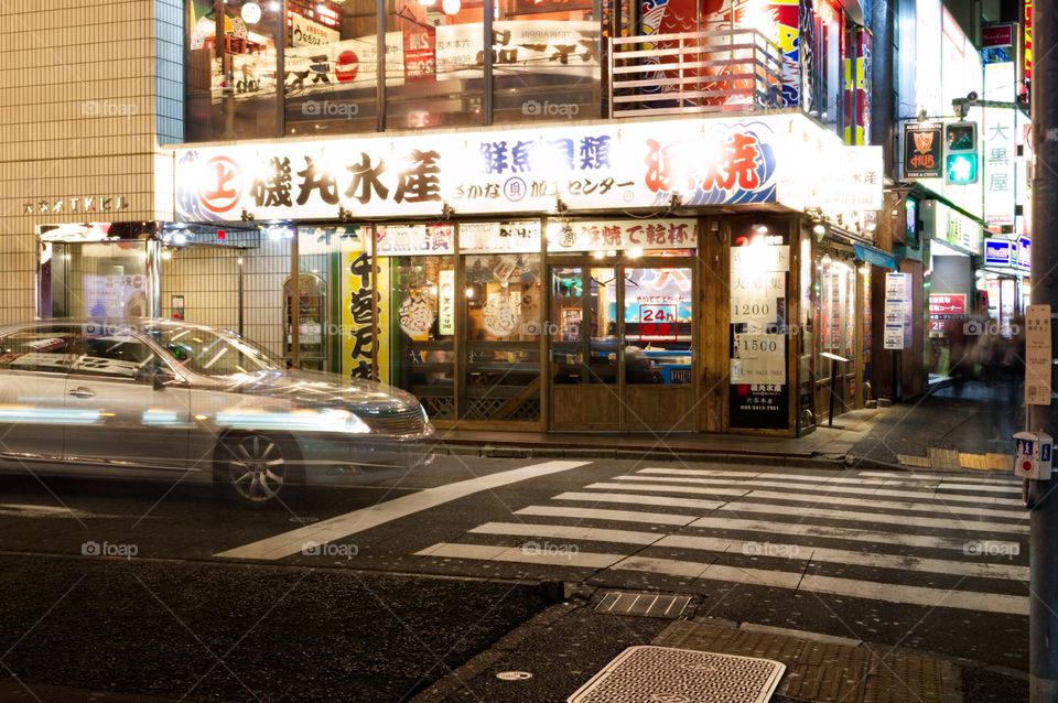 intersection of a street in Tokyo at night