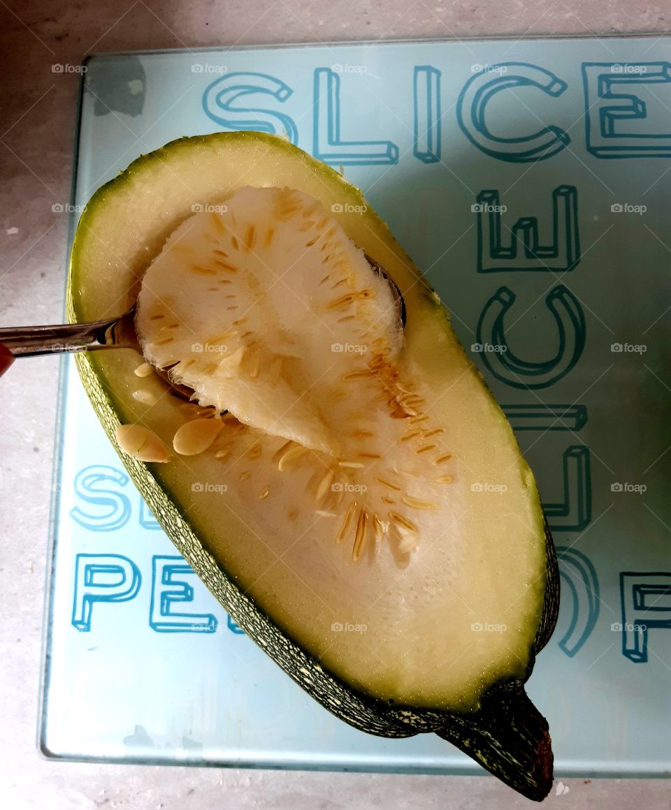 preparing a marrow for our evening meal. 
1. cut the lid off
2. scoop out the seeds
Next step to follow......