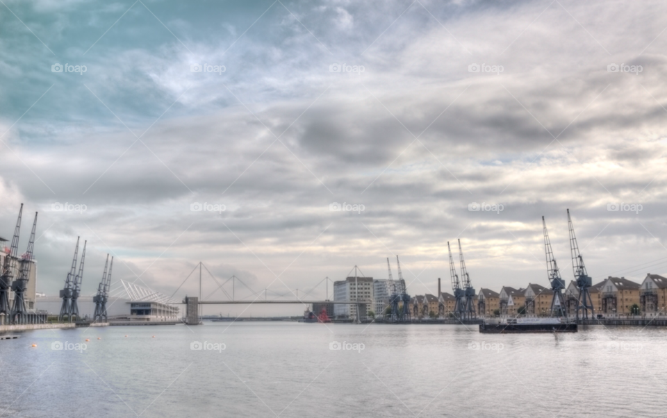 royal albert docks london uk clouds water bridge by bengrant