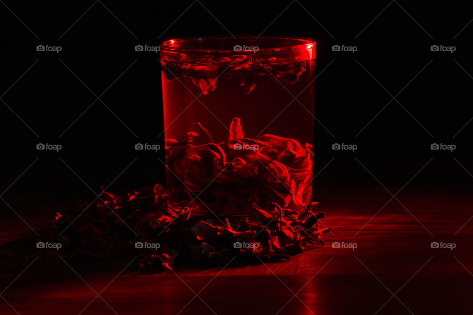 red carcade tea in transparent glass. red color concept