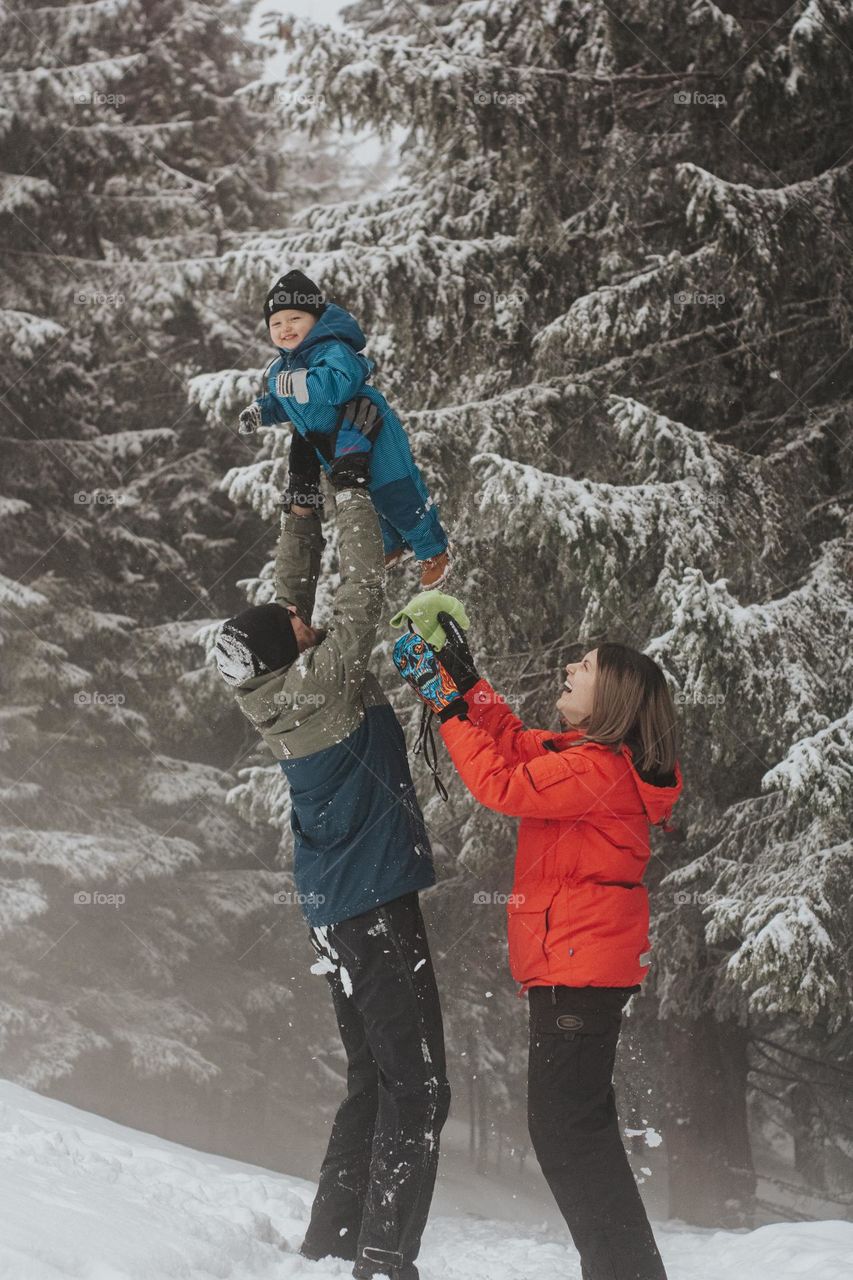 baby boy having fun with his family