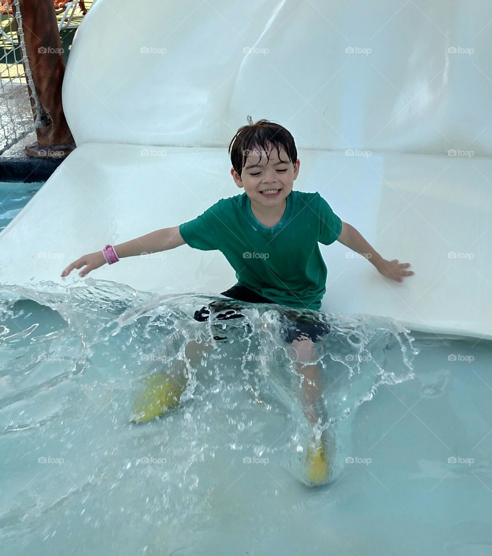 boy on waterslide at waterpark in San Antonio