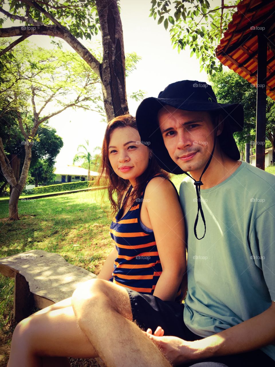 Close-up of couple sitting in park