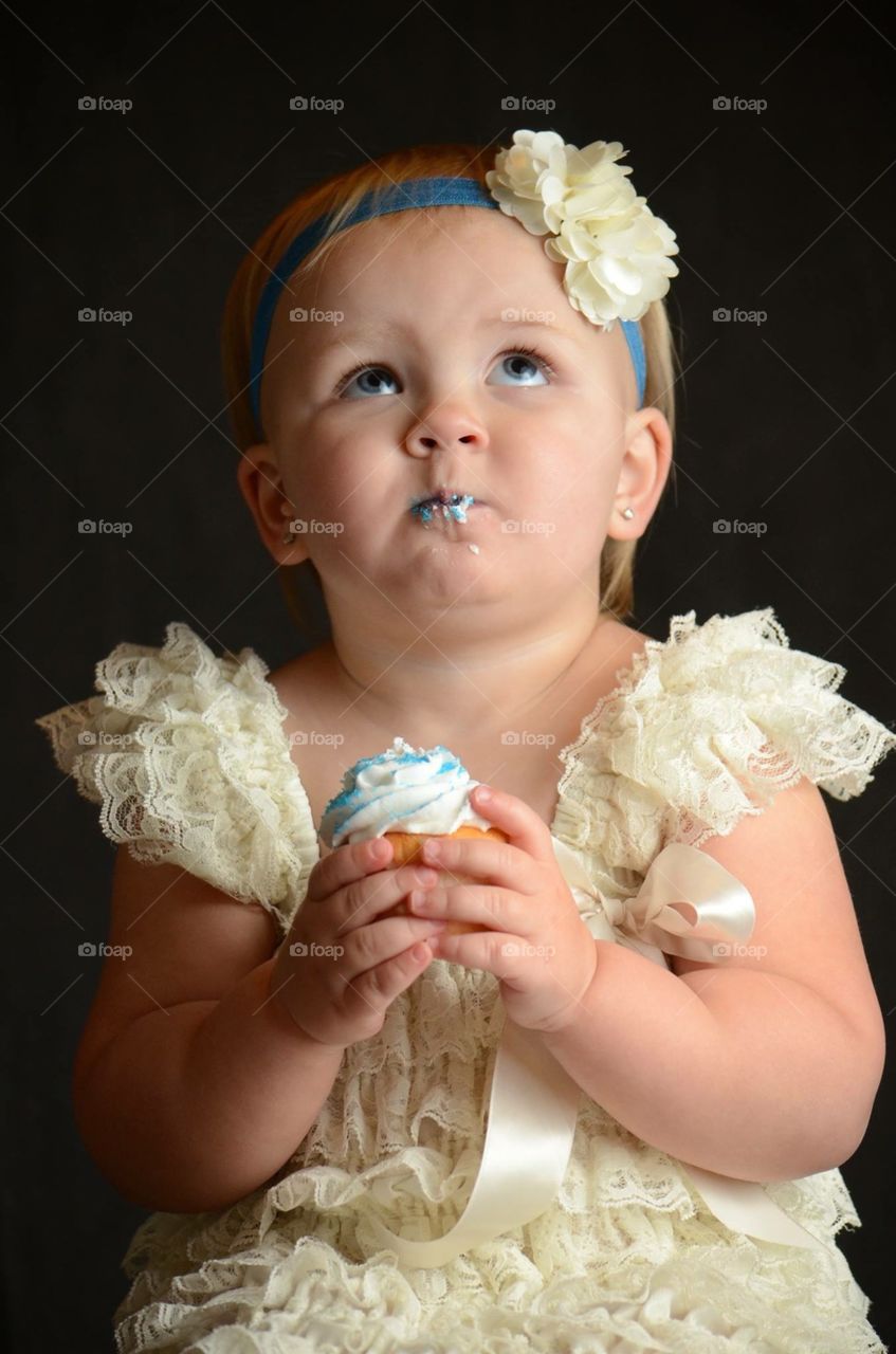 A girl and a cupcake. 2 year old photo shoot