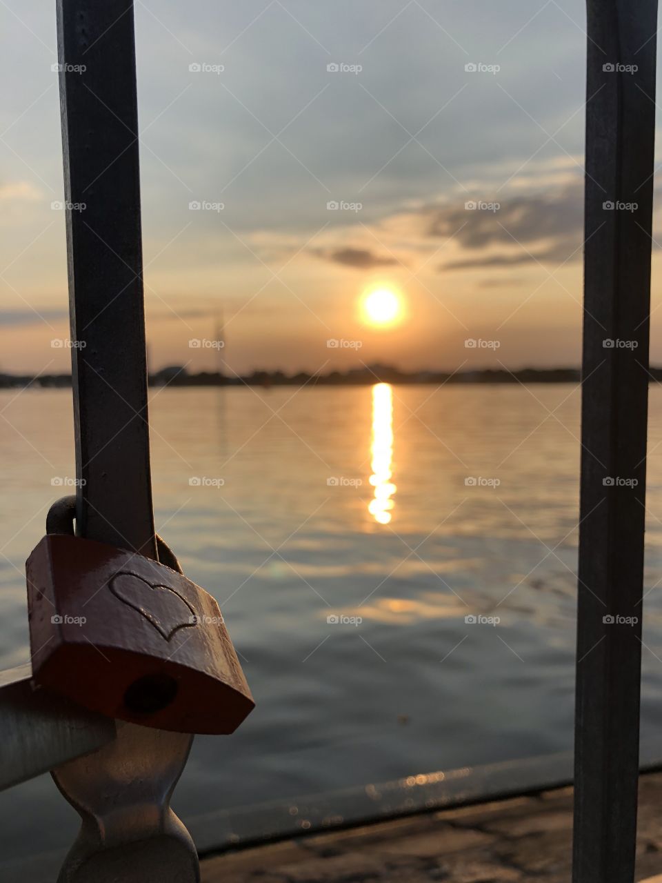 Love lock with a sunset in Hamburg. Romantic times.