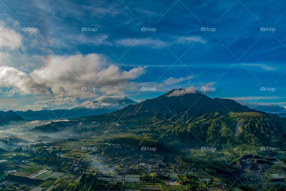 Beautiful and magnificent morning with the view of mountains, sky and the village of Pinggan in Bali Indonesia