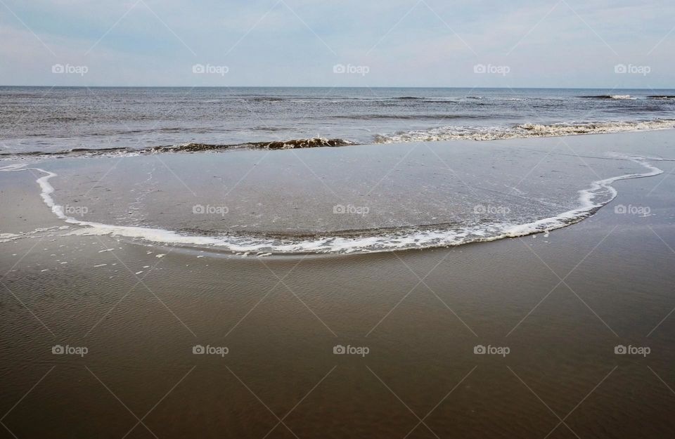 The island Terschelling, The Netherlands, seashore, waves on the beach, quiet sea, space