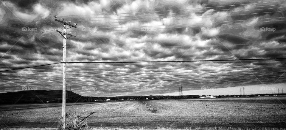 Autumn field and clouds