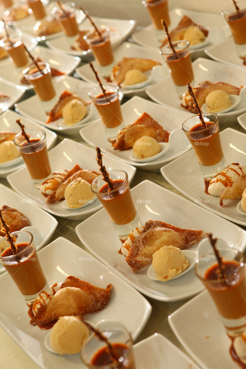 Dulce de leche, caramel, ice cream, empanada and fried cake treat line