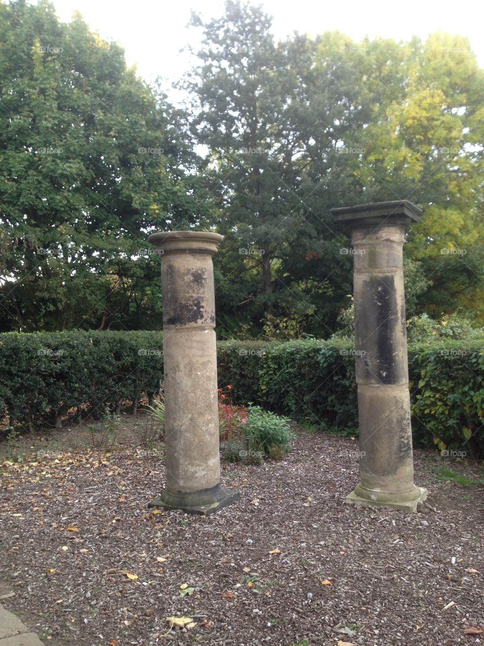 Stone pillars. Stone pillars up cycled into garden ornaments