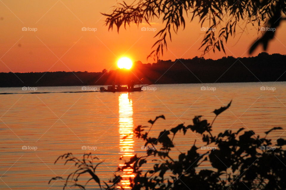 Pymatuning Sunset. we were camping at pa state park pymatuning & saw this photo of the sunset with the fishing boat during sunset walk
