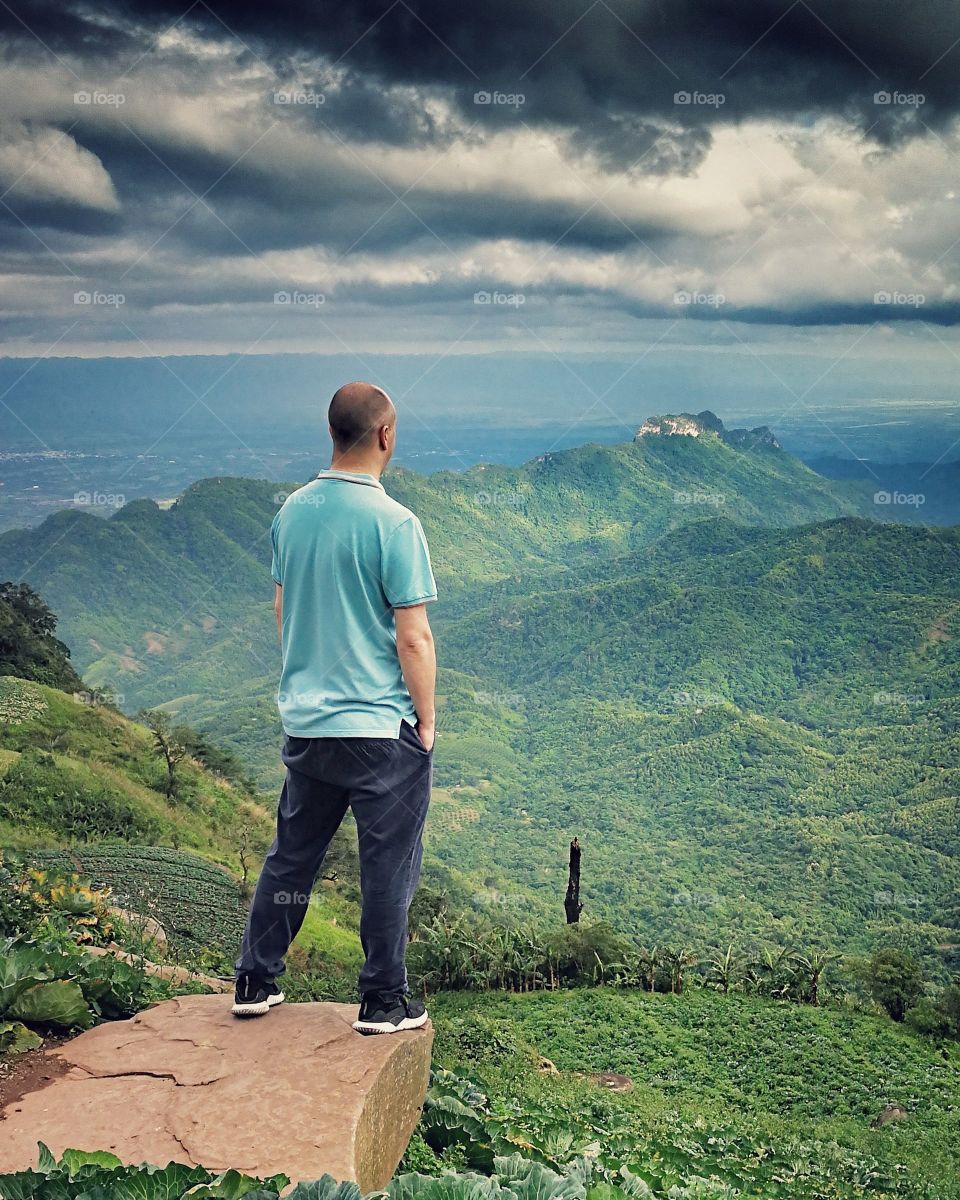 Travel and Landscape photographer overlooking landscape in Thailand