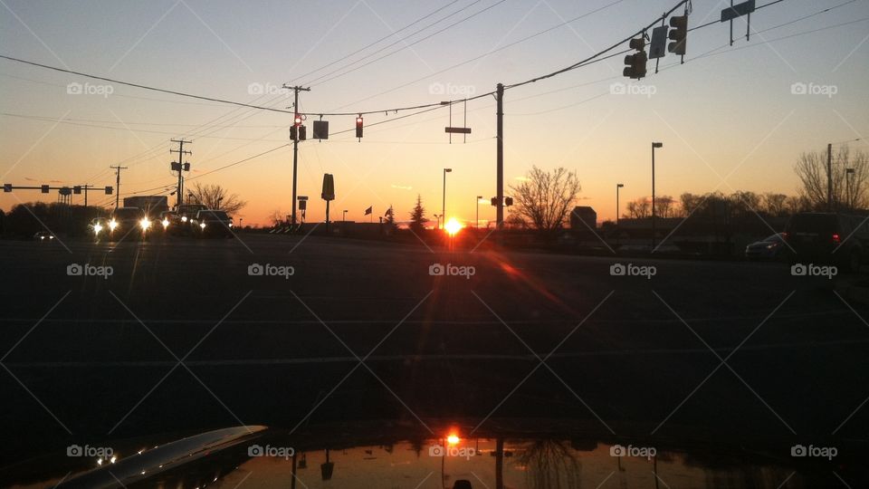 Car hood sunset reflection 