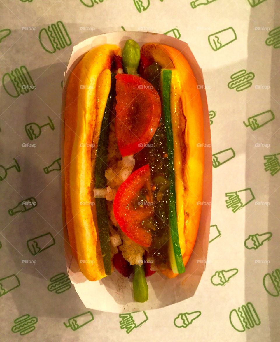 Hot dog with cucumber cheese and relish 