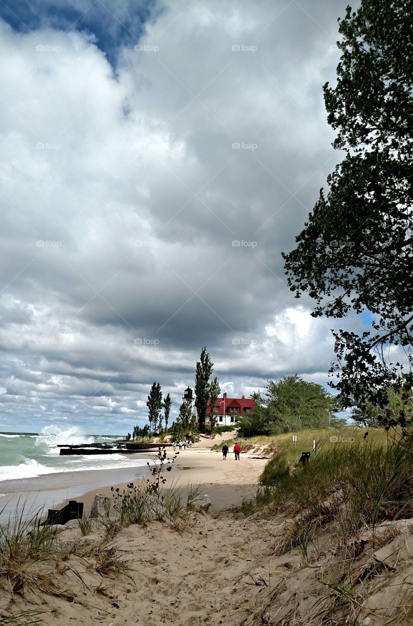 Pointe Bestie Lighthouse in Frankfort MI beach on a windy day