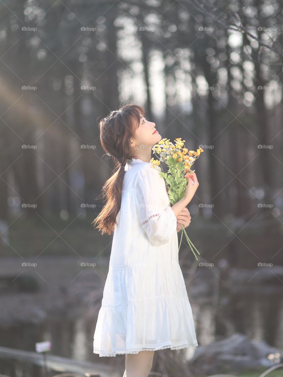 A girl holding flowers