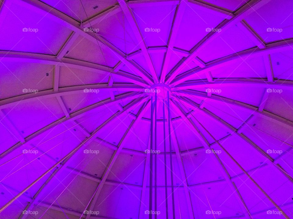 Purple lighted dome ceiling with ribbed vaults