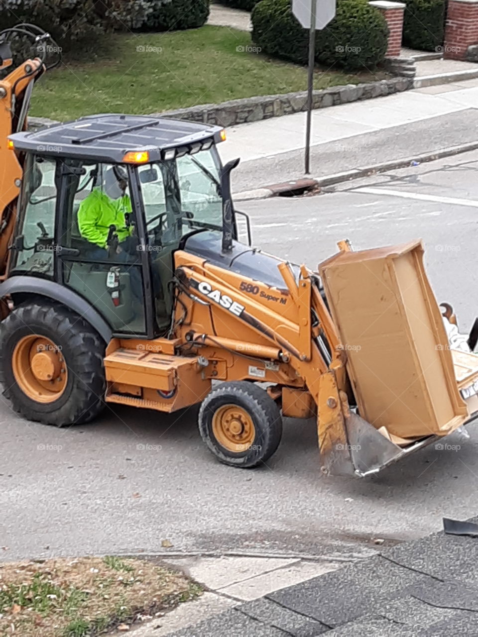 Workers moving roadside trash from old tenants