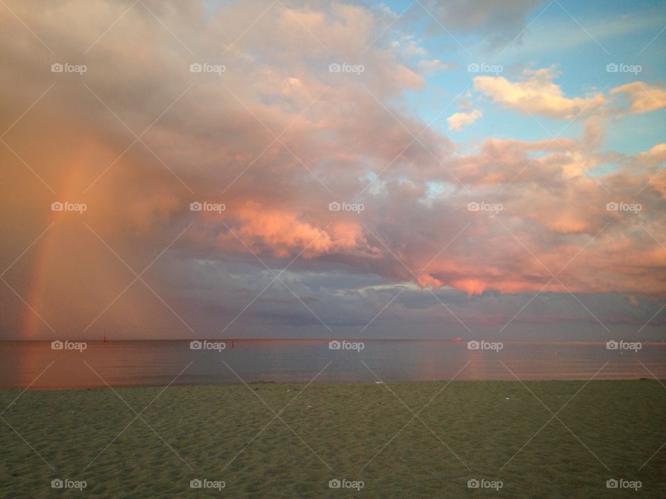 Sunset sky with rainbow over the Baltic Sea in Poland Gdynia 