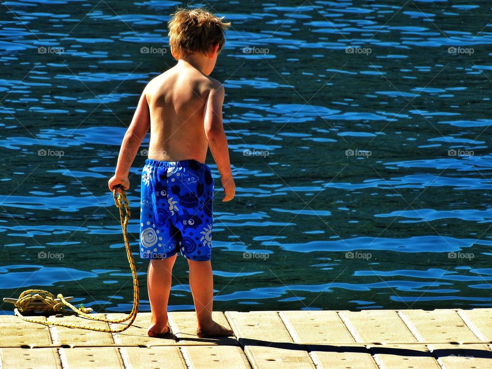 Boy Near Lake In Summer 