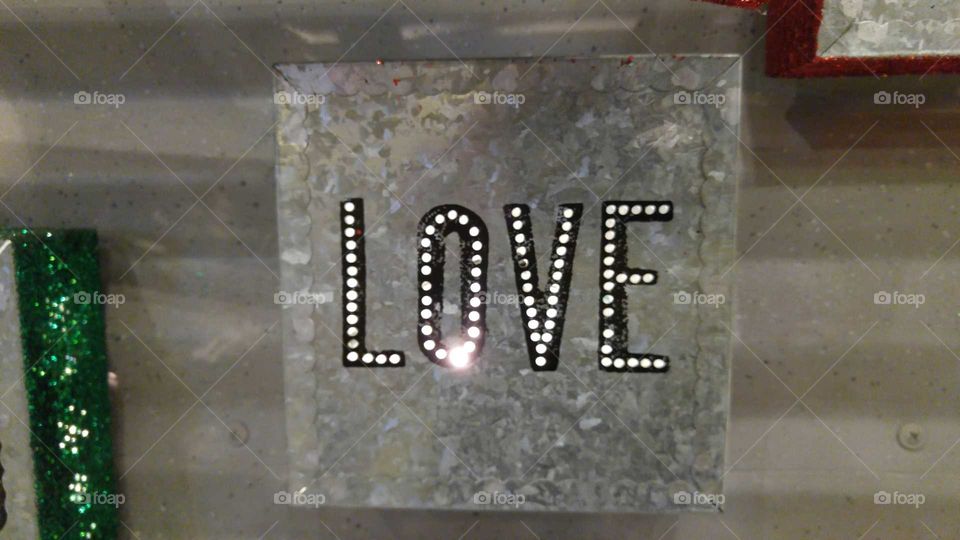 Metal Sign with the word Love in Lights