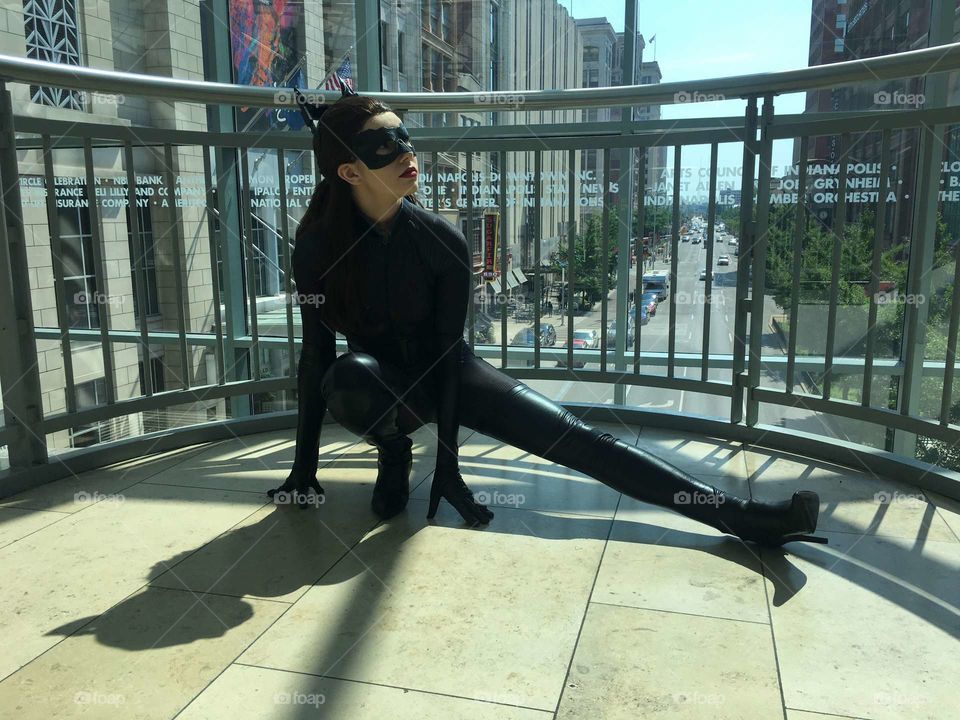 A strong young woman cosplaying as Catwoman