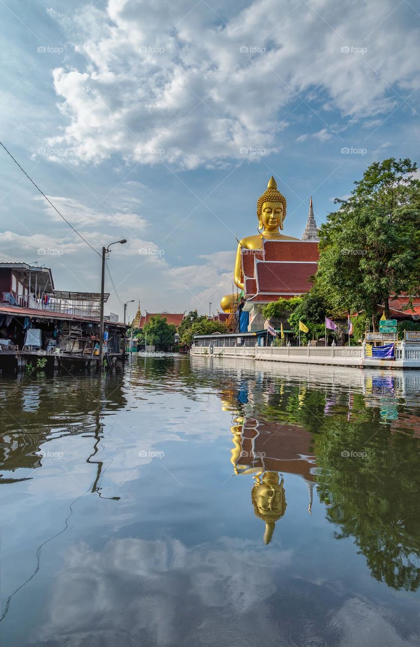 Big Buddha and reflection in river