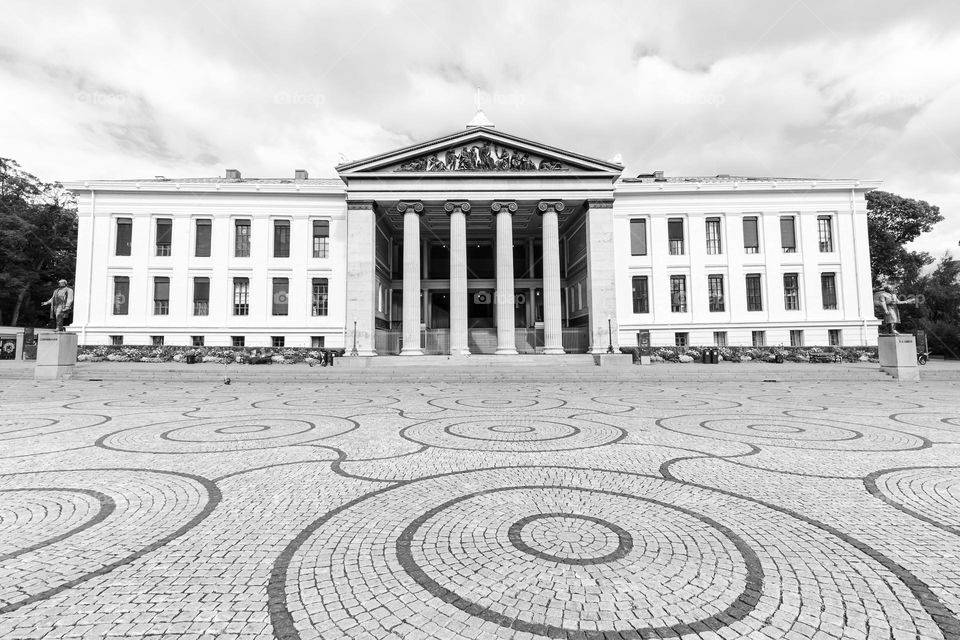 Old building with geometric circle patterns on the ground in Oslo Norway 
