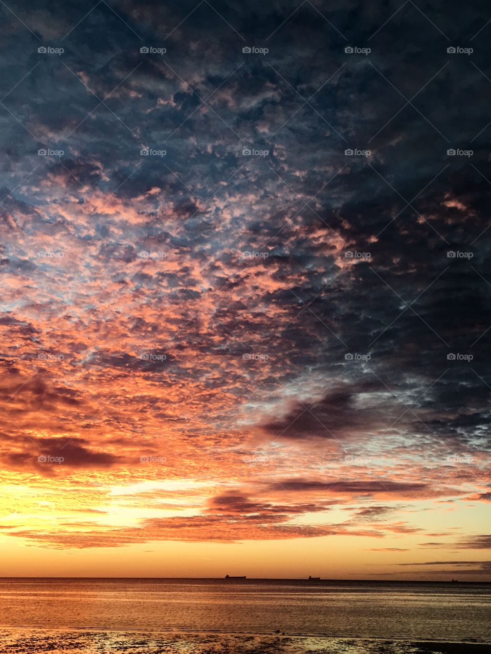 Storm on the horizon at sunrise on the ocean 